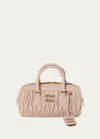 Miu Miu Zip Quilted Leather Top-handle Bag In F0236 Cipria