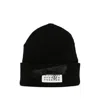 Mm6 Maison Margiela Mm6 By Maison Margiela Ribbed Black Knitted Beanie With Contrasting Logo Patch In Black