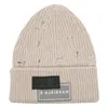 Mm6 Maison Margiela Ribbed Knit Beanie With Folded Cuff And Decorative Patches In Neutral