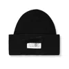 Mm6 Maison Margiela Ribbed Beanie With Logo Tag In Black
