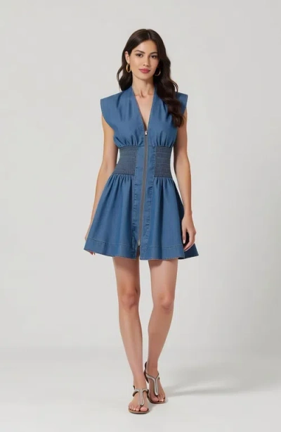 Modenaire Denim Mini Dress With Cap Sleeves Smocked Waist And Front Zip Closure In Blue