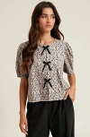 Modenaire Puff Sleeve Blouse With Velvet Bow Accents And Crew Neckline In Multi