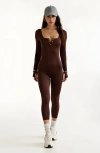 Modenaire Ribbed Long Sleeve Henley Jumpsuit With Deep Neckline And Snap Detail In Brown