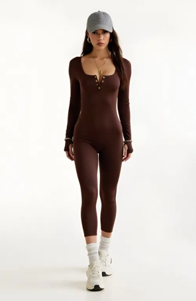 Modenaire Ribbed Long Sleeve Henley Jumpsuit With Deep Neckline And Snap Detail In Brown