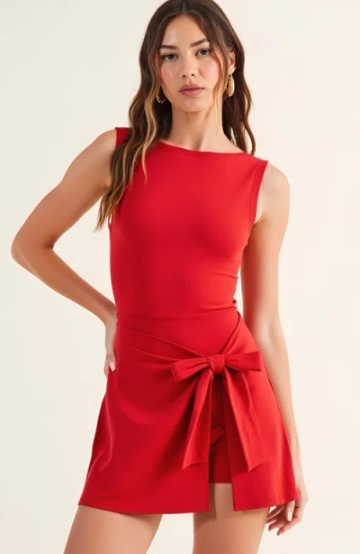 Modenaire Sleeveless Active Romper With Side Tie Skirt Overlay And Crew Neckline In Red