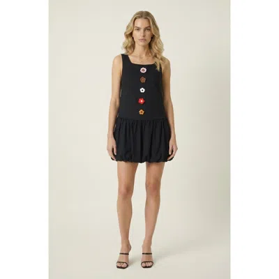 Modenaire Sleeveless Mini Dress With Floral Applique And Bubble Hem In Black