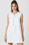 Modenaire Sleeveless Mini Dress With Zip Front And Patch Pockets In White