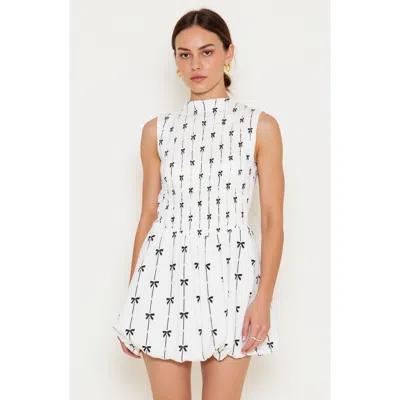 Modenaire Sleeveless Smocked Mini Dress With High Neckline In White/black
