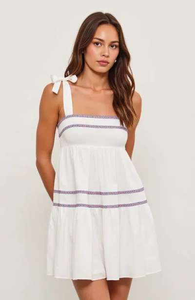 Modenaire Sleeveless Tiered Mini Dress With Embroidered Trim And Tie Straps In White/blue/red