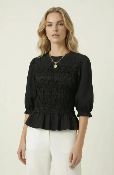 Modenaire Smocked Peplum Puff Sleeve Blouse In Black