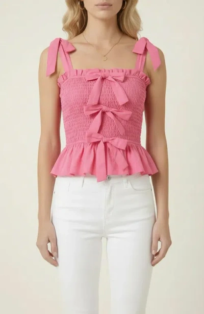 Modenaire Smocked Peplum Top With Bow Tie Straps And Ruffle Hem In Pink