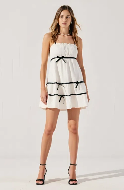 Modenaire Spaghetti Strap Mini Dress With Ruffled Trim And Bow Accents In White/black Trim