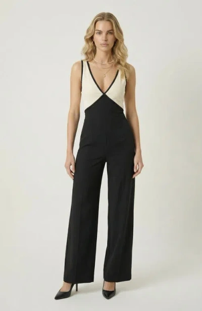 Modenaire Two-tone Wrap Bodice Jumpsuit In Black