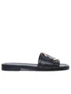 Moncler Black Slides With Distinctive Gold Emblem In Black