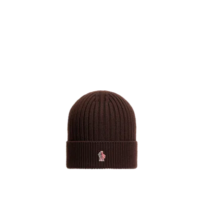 Moncler Logo-patch Ribbed-knit Beanie Hat In Brown