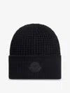 Moncler Textured Knit Hat With Prominent Logo Detail In Black