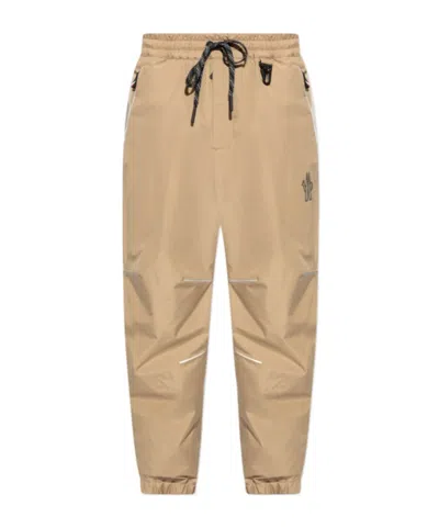 MONCLER MONCLER GRENOBLE LOGO EMBOSSED DRAWSTRING TRACK PANTS