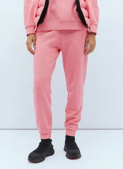 Moncler Embossed Logo Track Pants In Pink