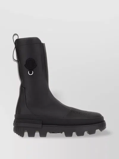 MONCLER GENIUS CHUNKY HEELED LEATHER BOOTS WITH LUG SOLE