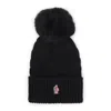 Moncler Cable Knit Logo Pom Pom Beanie In Black