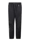 Moncler Logo Embossed Drawstring Track Pants In Black
