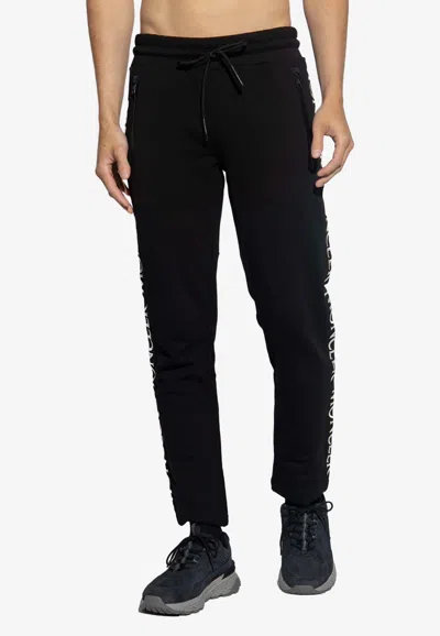 Moncler Logo Embroidered Track Pants In Animal Print