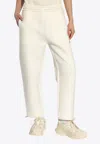 Moncler Logo Patch Track Pants In Cream
