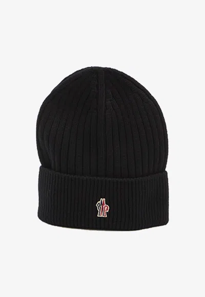 Moncler Logo Patch Wool Knitted Beanie In Black