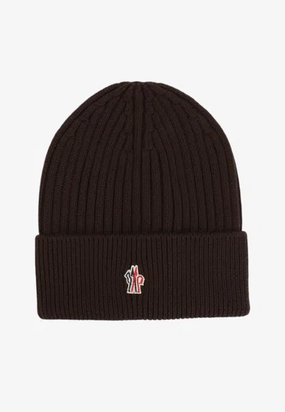 Moncler Logo Ribbed Wool Beanie In Brown