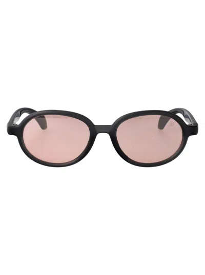 Moncler Matte Transparent Grey Injectate Sunglasses In Black