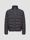 Moncler Quilted Down Jacket With High Collar And Logo Patch In Blue