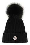 Moncler Ribbed Knit Wool Beanie With Faux Fur Pom-pom In Schwarz