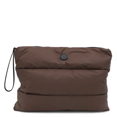 Moncler Quilted Logo-patch Clutch Bag In Brown