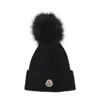 Moncler Ribbed Knit Hat With Fluffy Pom-pom In Black
