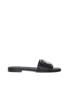 Moncler Black Slides With Distinctive Gold Emblem In Black