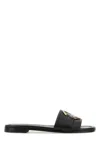 Moncler Black Slides With Distinctive Gold Emblem In Black