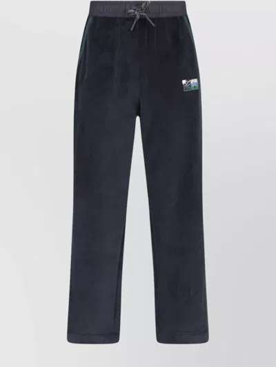 MONCLER STRAIGHT TROUSERS WITH ELASTIC WAISTBAND AND SIDE POCKETS