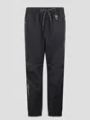 Moncler Logo Embossed Drawstring Track Pants In Black