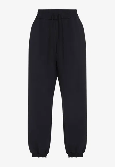 MONCLER TRACK PANTS IN TECH FABRIC