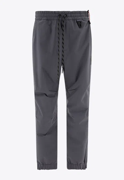 MONCLER TRACK PANTS IN TECH FABRIC