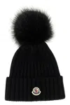 Moncler Ribbed Knit Wool Beanie With Faux Fur Pom-pom In Black