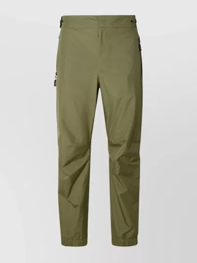 Moncler Trousers Featuring Zippered Pockets In Green