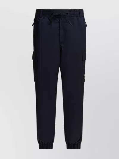 MONCLER UTILITY TROUSERS WITH ELASTIC FEATURES AND POCKETS