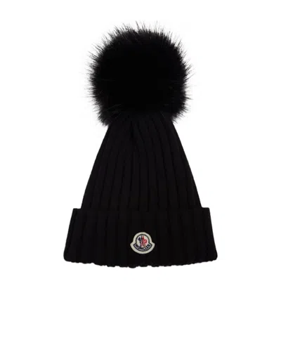 Moncler Ribbed Knit Wool Beanie With Faux Fur Pom-pom In Black