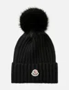 Moncler Ribbed Knit Wool Beanie With Faux Fur Pom-pom In Black