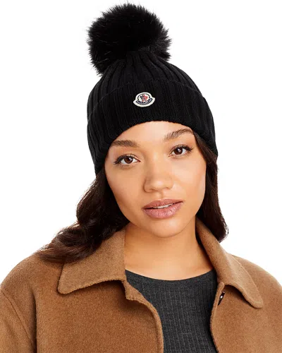 Moncler Ribbed Knit Wool Beanie With Faux Fur Pom-pom In Black