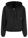 Moose Knuckles Cropped Black Faux Fur Jacket With Plush Hood And Zippered Pockets In Black