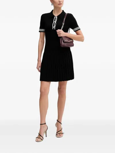 Morgan Pleated-skirt Polo Mini Dress In Black