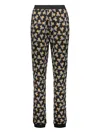 Moschino All-over Print Trousers In Black