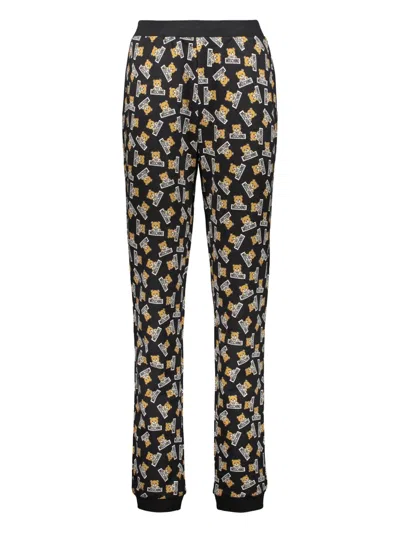 Moschino All-over Print Trousers In Black